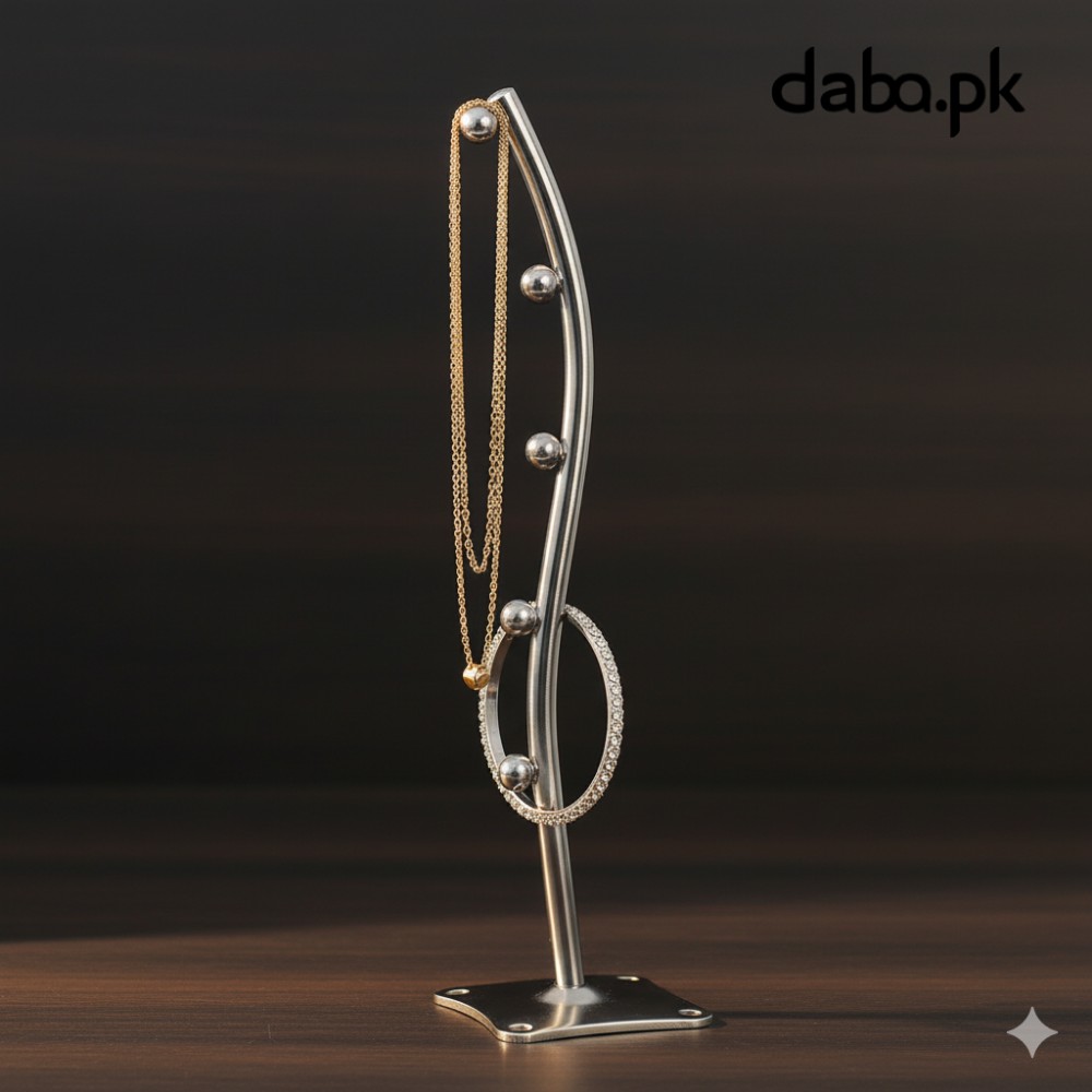 Waved metal jewelry organizer holding a gold chain and a diamond bracelet, highlighting its versatile display capacity for accessories.