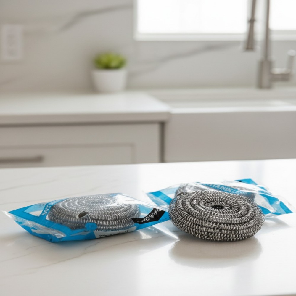 Close-up shot of a heavy-duty stainless steel scourer wrapped in bright blue retail packaging. Ideal for tough cleaning jobs.