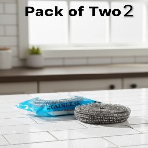Stainless steel scouring pads displayed as a pack (sealed) and one loose pad on a white kitchen counter, emphasizing the value of a multi-pack or set.