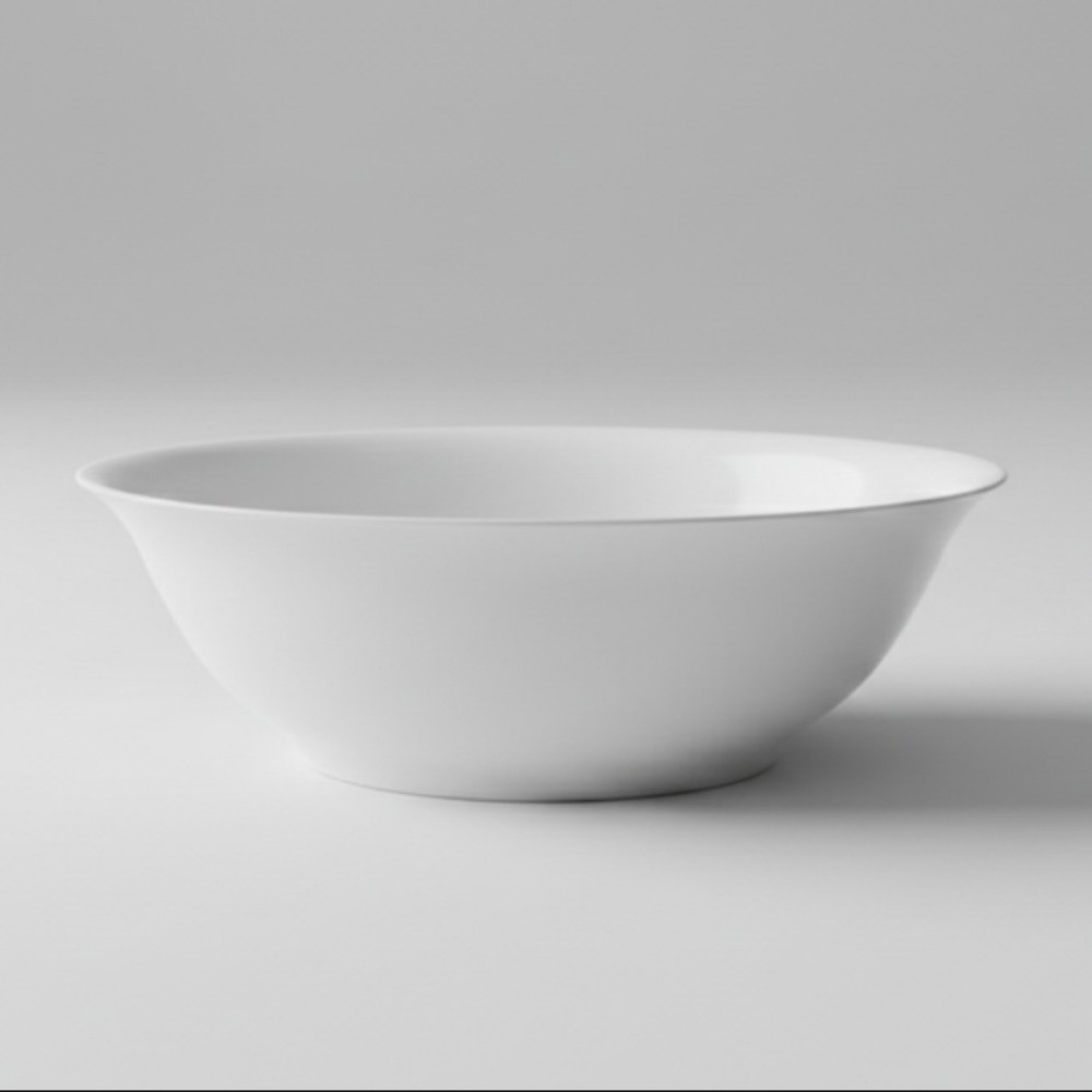 Minimalist studio shot of a single round white plastic bowl on a plain light grey background.