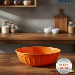 buy 1 get 1 free Single orange high-quality plastic serving bowl on a wooden kitchen counter with spice jars in the background.