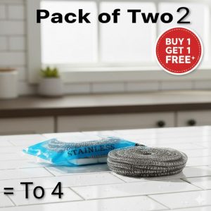 Buy 1 get 1 free Stainless steel scouring pads displayed as a pack (sealed) and one loose pad on a white kitchen counter, emphasizing the value of a multi-pack or set.